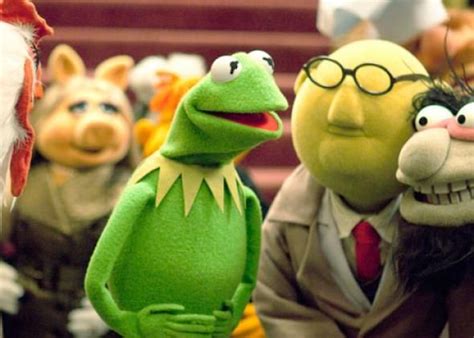 The Muppets Are Standing Next To Each Other