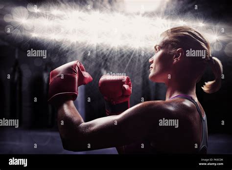 Composite Image Of Side View Of Female Boxer With Fighting Stance Stock