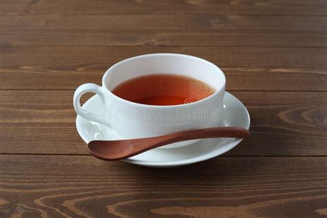 Cup Of Tea Isolated On Wooden Table Stock Photo Image Of Cloth Grey