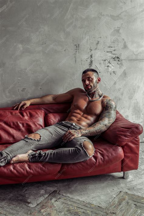 Premium Photo | Fashion portrait of sexy naked male model with tattoo