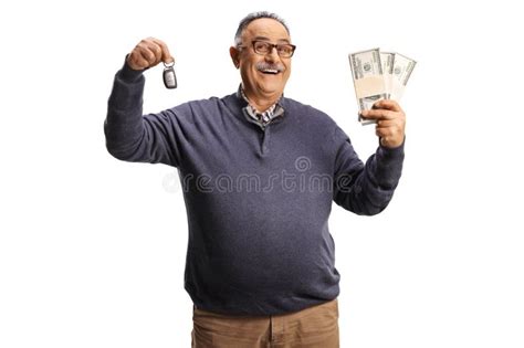 Smiling Mature Man Holding A Car Key And Stacks Of Money Stock Image