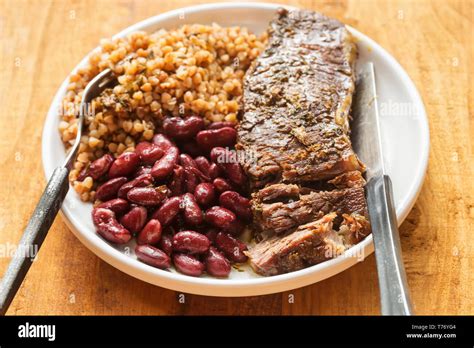 Braised Beef Steak In Red Wine With Beans And Barley Stock Photo Alamy