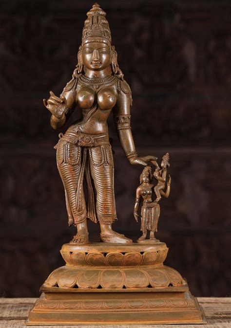 A Divine Statue Of Parvati Lovingly Standing On A Double Lotus Base