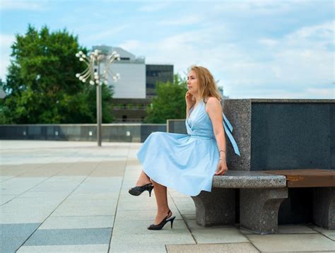 Premium Photo Beautiful Blonde Posing In A Blue Dress On The Street