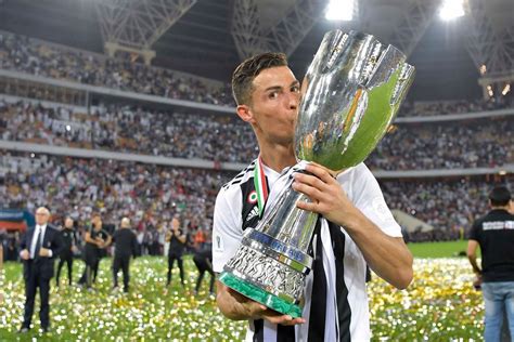 Cristiano Ronaldo Of Juventus Kisses The Trophy After Winning The