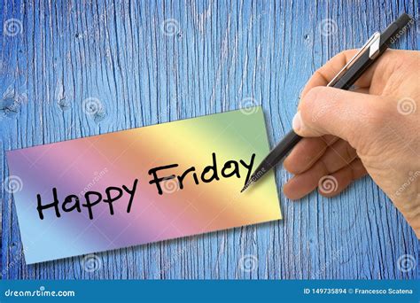 Hand Writing Happy Friday With A Pencil On A Colored Sheet Over A