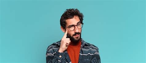 Premium Photo Young Crazy Bearded Man Thinking Or Doubting Expression