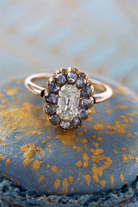 A Diamond Ring Sitting On Top Of A Blue Piece Of Rock With Gold Flecks