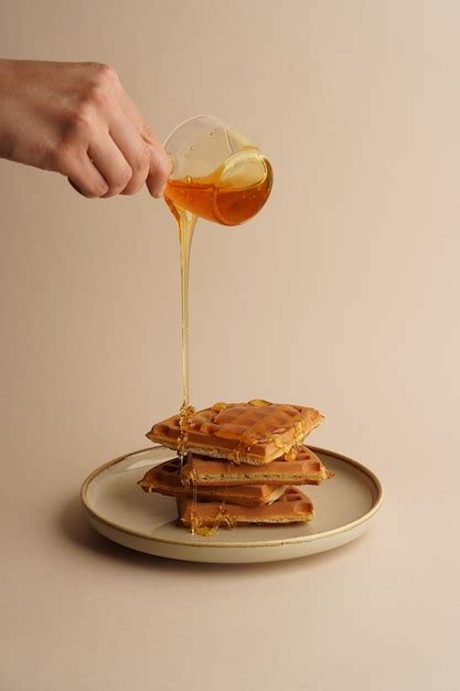 Premium Photo Delicious Belgian Waffles With Honey In Plate