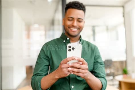 Selective Focus On The Smartphone In Hands Of Happy And Cheerful Indian