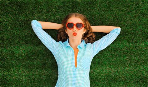 Summer Portrait Of Happy Young Relaxing Woman Wearing Red Heart Shaped