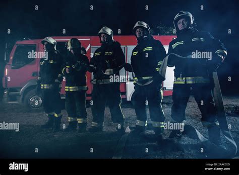 Fire Brigade Fighting A Forest Fire With Various Tools For Eliminating