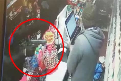 Masked Robbers Storm Grocery Shop Before One Holds Terrified Owner At