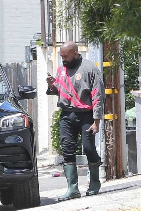 Kanye West looks unrecognizable with a big smile, full beard and ...