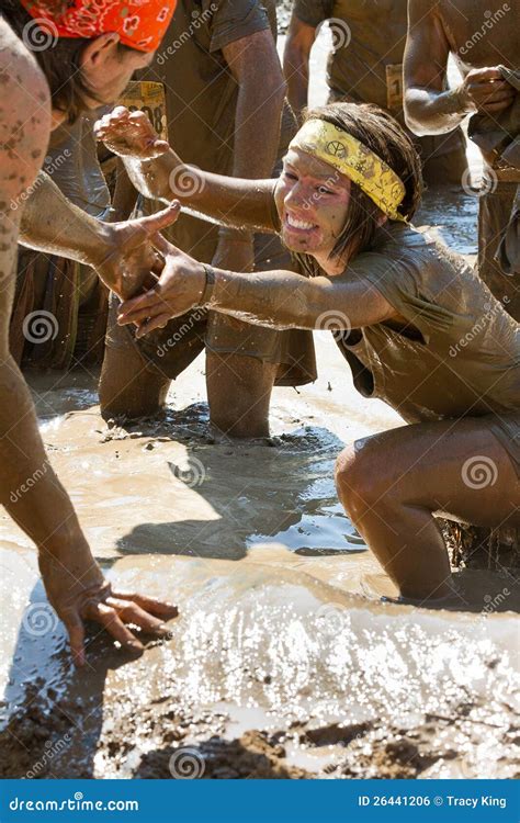 Woman Getting Help Up Out Of A Mud Pit Editorial Photo Image Of Race