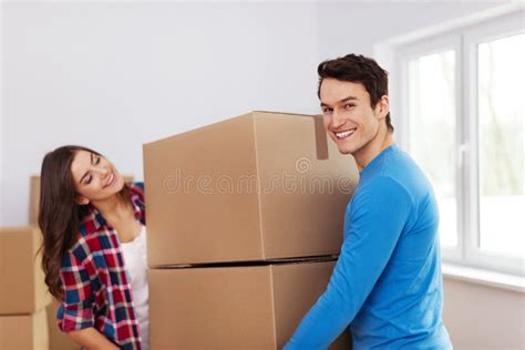 House Renovation Couple Carrying Boxes Stock Image Image Of Jeans