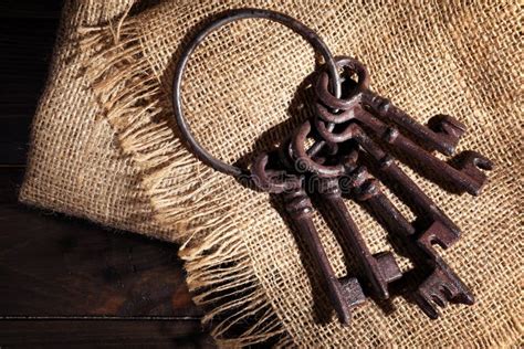 Bunch Of Old Vintage Keys On Wooden Background Top View Stock Photo