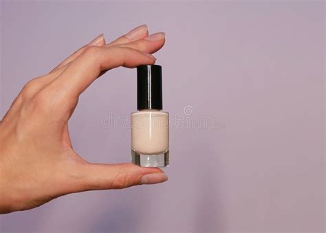Nude Beige Nail Polish In A Woman X S Hand Close Up Background
