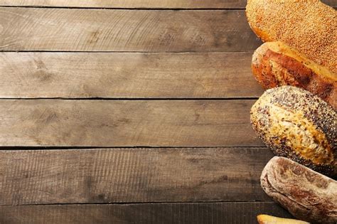 Premium Photo Bread On Wooden Background