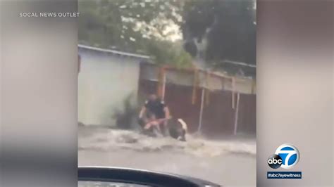 Dramatic bodycam video shows San Bernardino police rescue mother, 2 children from flash flood ...