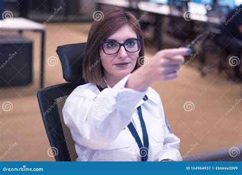 Security Guard Monitoring Modern CCTV Cameras In Surveillance Room