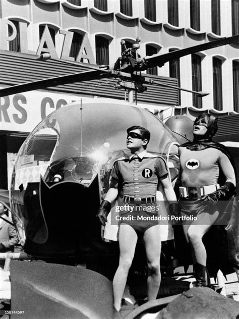 American Actors Adam West And Burt Ward Wearing The Costumes Of The