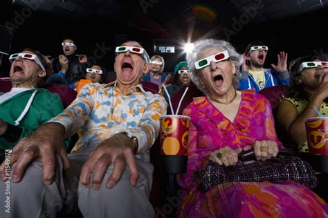 Movie Audience In 3d Glasses Making Faces Low Angle View Stockfotos