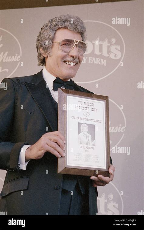 Rockabilly Singer Carl Perkins Poses With His Career Achievement Award During The Country Music