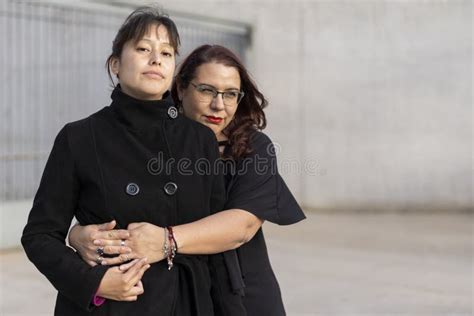 Couple Of Lesbian Women Hugging In A Park Stock Photo Image Of