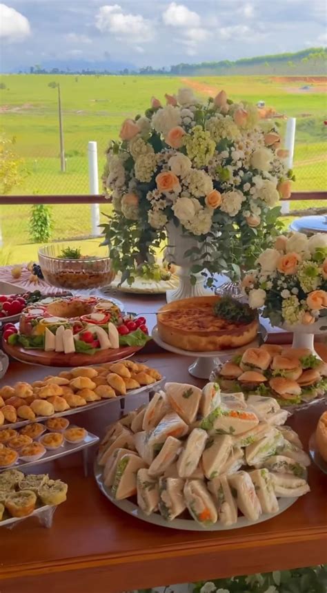 A Table Filled With Lots Of Food On Top Of A Wooden Table Covered In