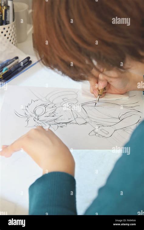 Japanese Manga artist working in the studio Stock Photo - Alamy