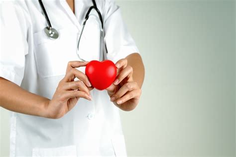 Premium Photo World Heart Day Concept Of Woman Doctor Hand Holding