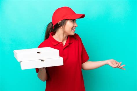 Premium Photo Pizza Delivery Woman With Work Uniform Picking Up Pizza