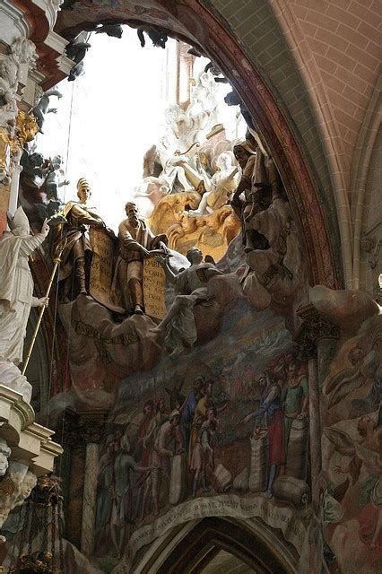 The Inside Of A Church With Statues And Paintings