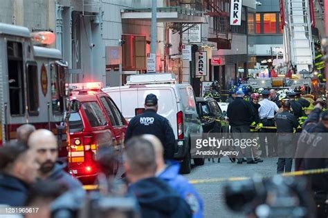 Firefighters Inspect The Partially Collapsed Parking Garage In News