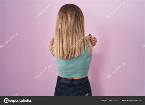 Blonde Caucasian Woman Standing Pink Background Hugging Oneself Happy Positive Stock Photo