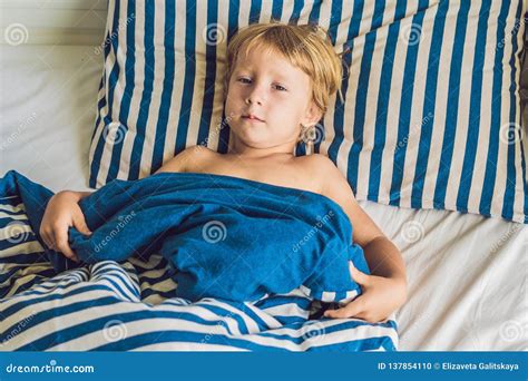 The Cute Boy Woke Up In His Bed Children Sleep Concept Stock Photo