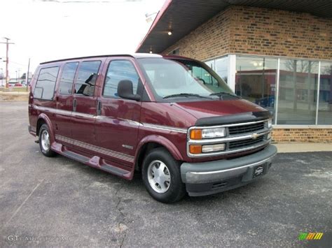 Dark Carmine Red Metallic 1999 Chevrolet Express 1500 Passenger Conversion Van Exterior Photo