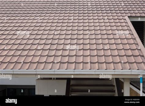 Ceramic Tile Roof On A Background Of House Stock Photo Alamy