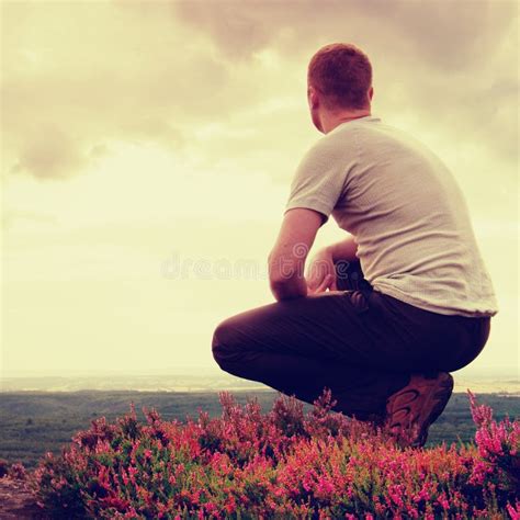 Man Squatting In The Bushes Stock Photo Image Of White Dark