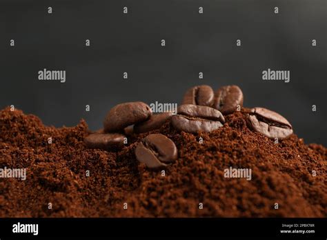 Pile Of Ground Coffee With Roasted Beans Closeup Stock Photo Alamy