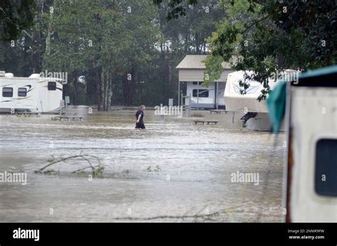 A Man Walks Through Flossed Waters At A Campground In Magnolia Miss