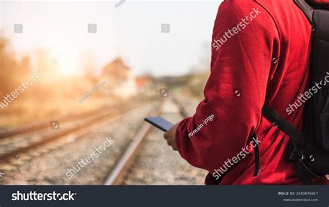 Young Photographer Walking Along Train Track Stock Photo 2140876917