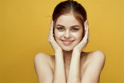 Pretty Woman Naked Shoulders And Posing Clear Skin Yellow Background