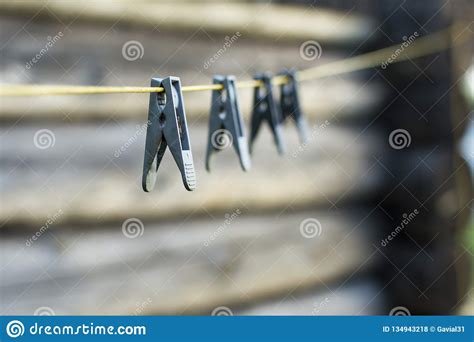 Pinzas En Una Cuerda Para Tender La Ropa Foto De Archivo Imagen De