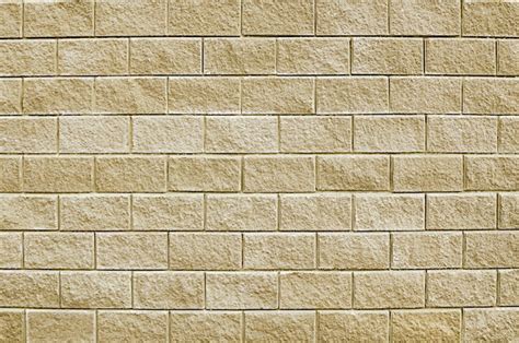 Premium Photo | Old beige stone wall background texture