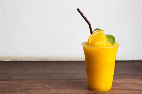 Premium Photo Orange Juice Blended In Plastic Cup Freshness Beverage