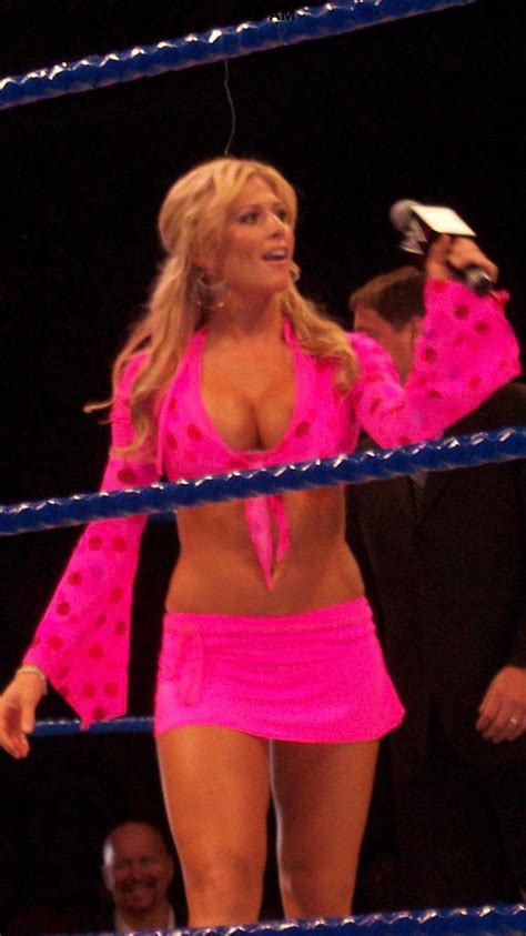 Torrie Wilson And Those Huge Tits Getting Pushed Up While We Wonder