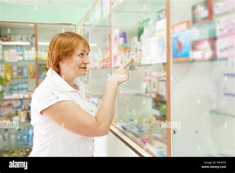 Mature Woman Near Counter In Pharmacy Drugstore Stock Photo Alamy
