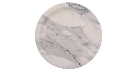 An Oval Marble Plate With White And Black Veining On The Edges Set